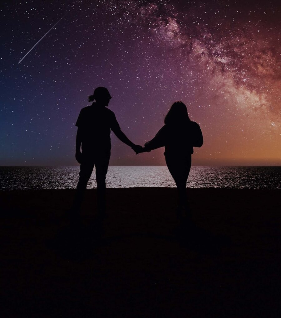 Two hands reaching towards each other